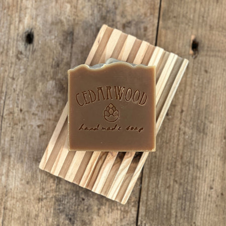 Milk chocolate mint handmade soap bar on wood soap dish