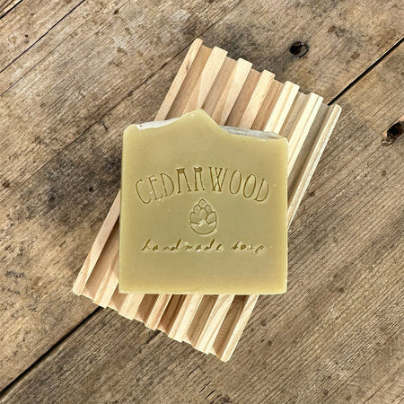 Patchouli handmade soap bar on wood soap dish