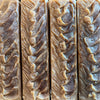 Four loaves of cinnamon oatmeal soap with detailed swirl pattern