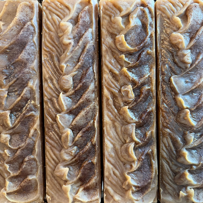 Four loaves of cinnamon oatmeal soap with detailed swirl pattern