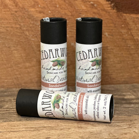 Three kraft paper tubes of sandalwood-scented deodorant