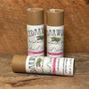 Three kraft paperboard tubes of handmade, all-natural Rose Geranium deodorant