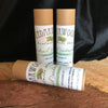 Three kraft paper tubes of Cedarwood Balsam-scented deodorant