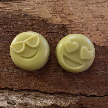 Two Happy Hemp smiley face emoji lotion bars