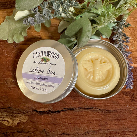 Lavender-scented lotion bar with bee imprint design in aluminum tin