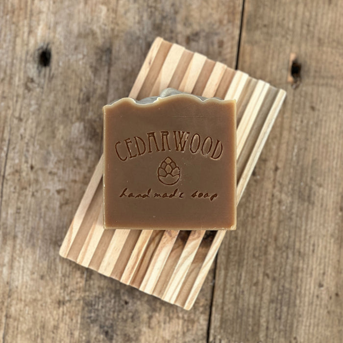 Handmade milk chocolate mint soap on wood soap dish