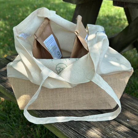 reusable cotton tote bag with two kraft paper bags of laundry powder