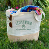 reusable cotton tote bag holding two beach towels