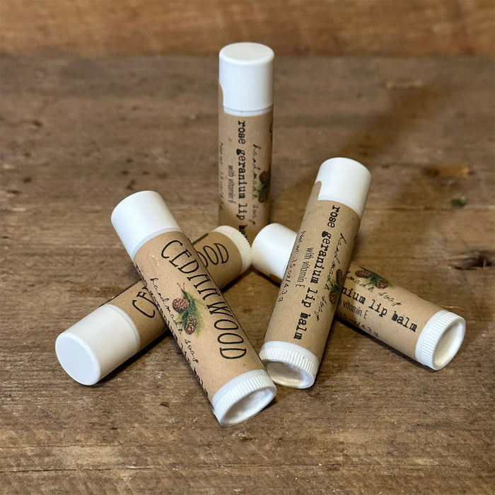 Five tubes of Rose geranium lip balm