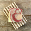 Handmade cherry blossom bar soap on wood soap dish