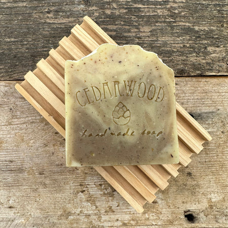 Handmade sandalwood soap bar on wood soap dish