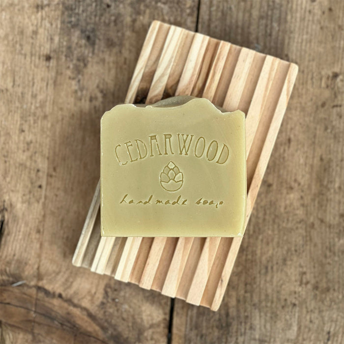 Handmade shaving soap bar on wood soap dish